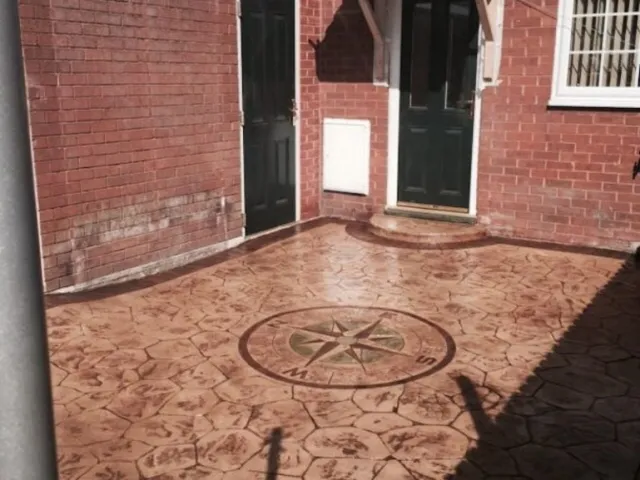 Sandstone walnut colour with acid edge printed concrete driveway